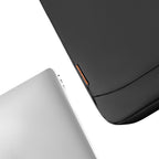CloudCase Ultra-Thin Black Laptop Sleeve with Orange Accent, shown beside a silver laptop for 360° protection.