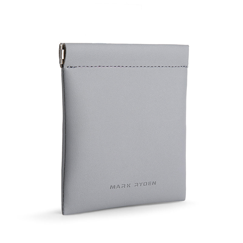 Light gray Mark Ryden coin pouch with smooth texture, metal clip, and secure design for effortless valuables carry.