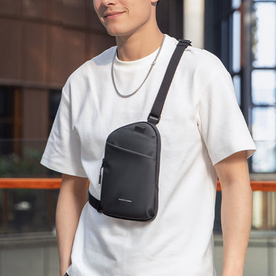 MarkRyden Global black anti-theft business sling bag worn by modern professional