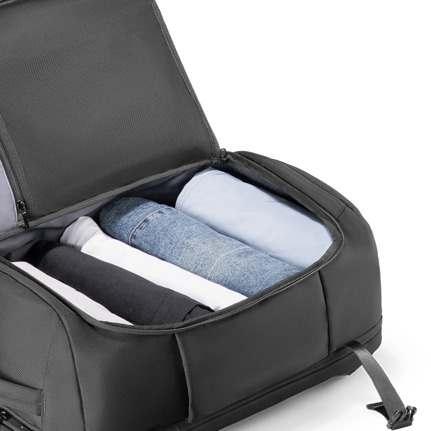 Mark Ryden Aegis Fortress backpack storing rolled clothing in main compartment