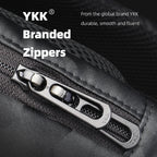Close-up of YKK branded metallic zippers on black tactical commuter backpack, showcasing durable and smooth functionality for urban use.