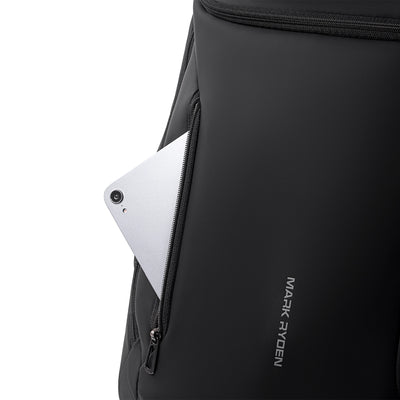Mark Ryden black futuristic backpack with zippered pocket holding silver device