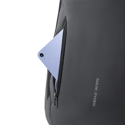 Mark Ryden dark gray backpack with zippered pocket holding light blue phone, futuristic design