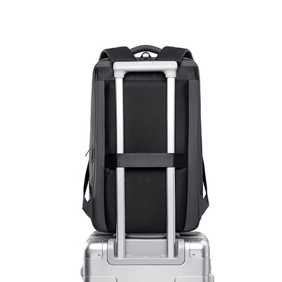 MarkRyden Compacto Pro daily backpack with mesh back, attached to silver luggage