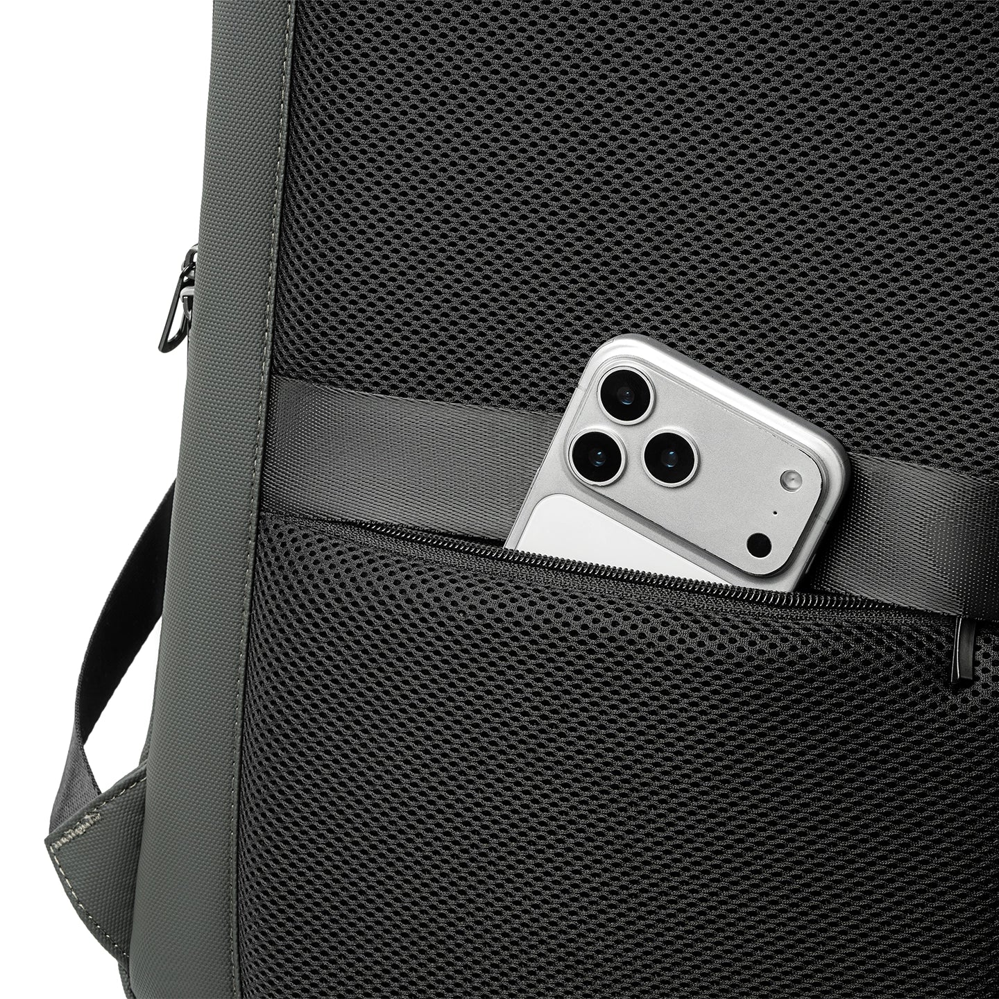 MarkRyden Compacto Pro futuristic backpack: black mesh with zippered pocket holding silver smartphone