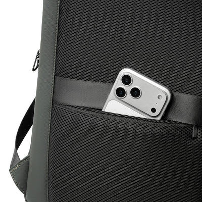 MarkRyden Compacto Pro futuristic backpack: black mesh with zippered pocket holding silver smartphone