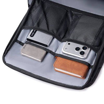 MarkRyden Compacto Pro daily backpack interior with mesh compartments holding power bank, phone, notebooks