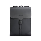 Black oxford backpack with classic business school style, flap closure with buckle, structured design, Mark Ryden logo.