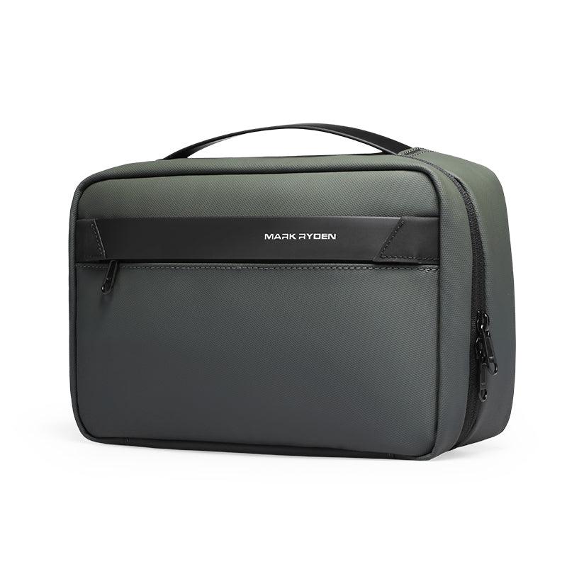 Dark green and black Mark Ryden compact washbag with multi-layer design, large capacity, zippered compartments, and top handle.